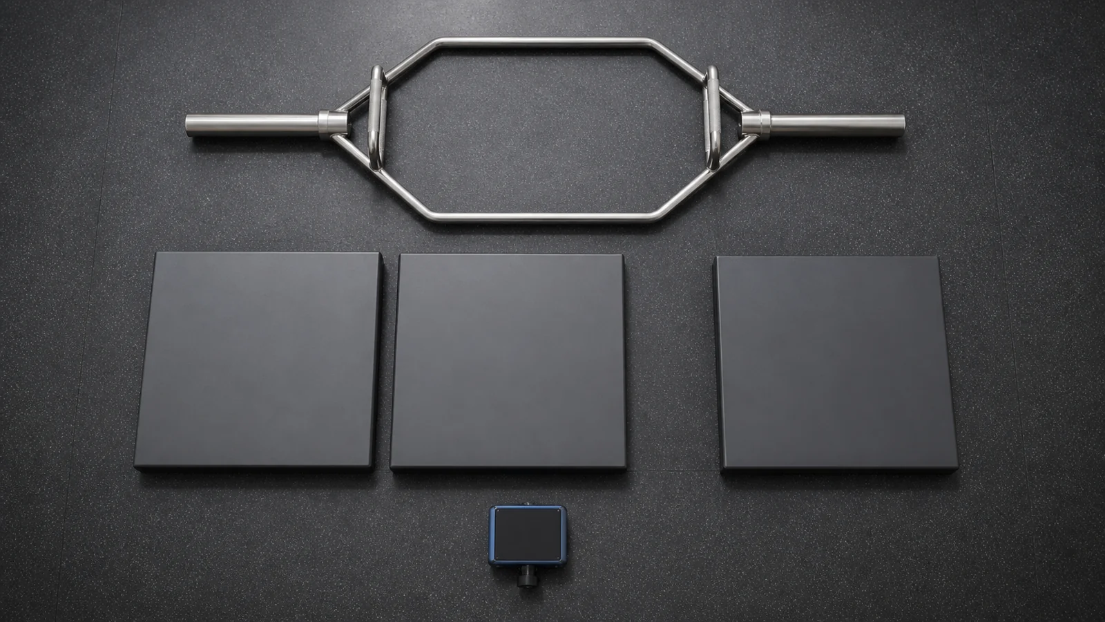 Three identical force-platform blocks, a blank velocity sensor, and an unloaded symmetric trap bar in a laboratory.